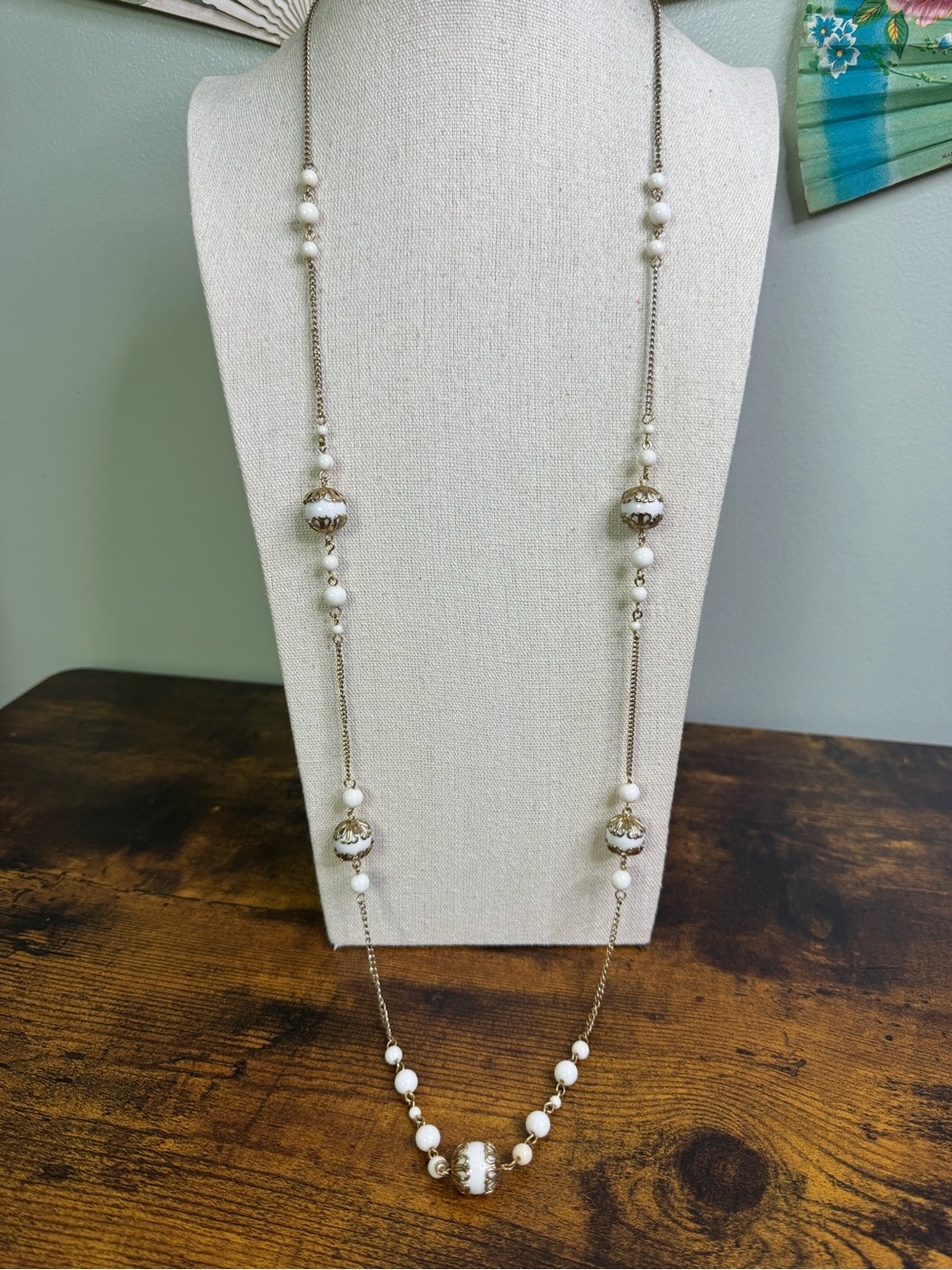 White Capped Bead Station Necklace in Gold Tone